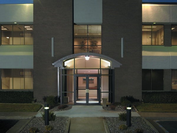 View of the Missouri Hospital Association building entrance at night.